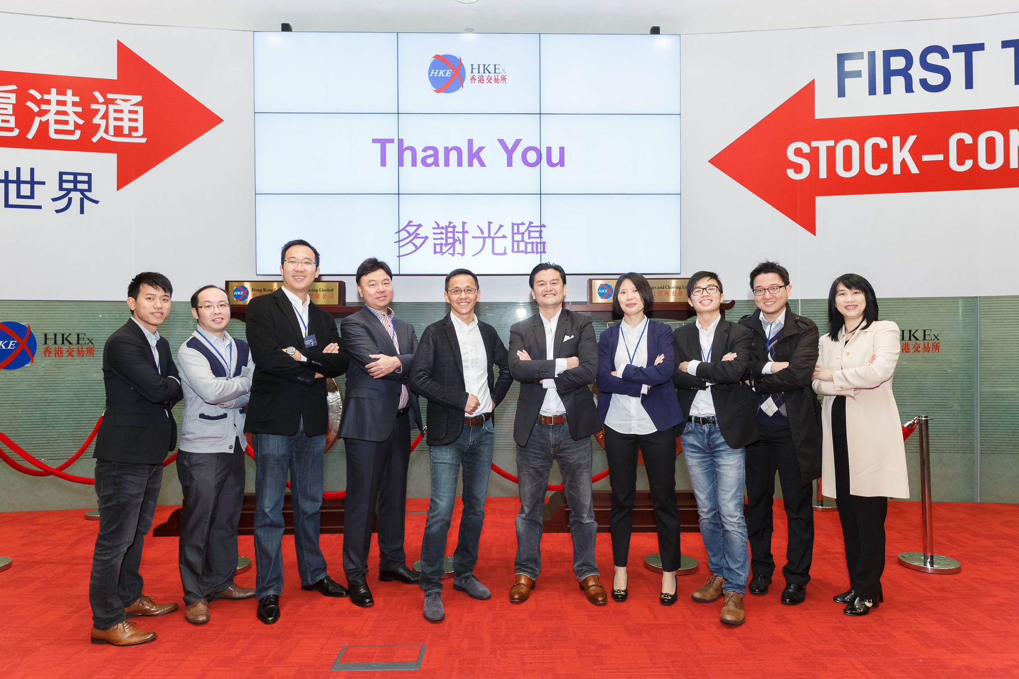Proud for having accomplished an IPO in under six months, Andrew (3rd from left) joins HKBN IPO project team members at the Hong Kong Stock Exchange.