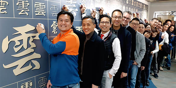 Our management team ceremoniously sign their names to back our pledge to Cloud-enable over one-third of our total Talent base.