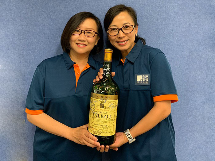 Celebrating our completed merger with a bottle of 1977 Chateau Talbot, St. Julien, our MIT Co-Heads, Almira Chan (left) and Clio Ip (right), will oversee integration of both companies. 
